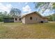 View of the back of the home, including a screened-in porch at 11480 Genter Dr, Spring Hill, FL 34609