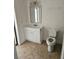 Bright bathroom featuring a white vanity with modern fixtures and tile flooring at 12619 98Th St, Largo, FL 33773