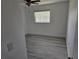 Bedroom with wood-look floors, closet space, and a ceiling fan at 12619 98Th St, Largo, FL 33773