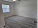 Bright bedroom with wood-look floors, closet space, and window at 12619 98Th St, Largo, FL 33773