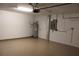 Spacious garage with epoxy flooring, overhead door, and water heater at 12619 98Th St, Largo, FL 33773