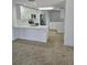 Modern white kitchen with quartz countertops and stainless steel appliances at 12619 98Th St, Largo, FL 33773