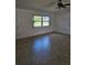 Bright living room featuring neutral tile flooring and a large window at 12619 98Th St, Largo, FL 33773