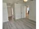Bright living area with wood-look floors and neutral wall paint at 12619 98Th St, Largo, FL 33773