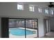 Outdoor pool area with a screened enclosure and colorful stained-glass window accents at 12619 98Th St, Largo, FL 33773