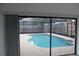 Backyard pool featuring screened enclosure, brick pavers, and privacy fence at 12619 98Th St, Largo, FL 33773