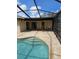 Screened in pool with an outdoor sink at 12619 98Th St, Largo, FL 33773