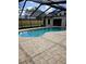 Enjoy the screened-in pool, perfect for outdoor fun and relaxation at 12619 98Th St, Largo, FL 33773