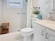 Clean bathroom featuring a shower, toilet and vanity at 1325 58Th N St # 204A, St Petersburg, FL 33710