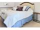 Bedroom featuring a comfortable bed, a dresser and a table at 1325 58Th N St # 204A, St Petersburg, FL 33710