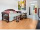 Inviting living area with access to the kitchen, bright painting, and colorful accents at 1325 58Th N St # 204A, St Petersburg, FL 33710