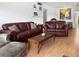 Spacious living room with a stylish couch, a modern lamp and decorative accents at 1325 58Th N St # 204A, St Petersburg, FL 33710