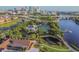 Scenic aerial view showcasing lush green park areas, a pond with walking paths, and a vibrant cityscape backdrop at 1724 W Saint Conrad St, Tampa, FL 33607
