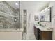 Modern bathroom with tiled shower, granite vanity, and stylish fixtures at 1724 W Saint Conrad St, Tampa, FL 33607