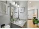 Charming bathroom with granite countertop vanity, brushed nickel fixtures, and decorative mirror at 1724 W Saint Conrad St, Tampa, FL 33607