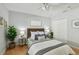 A well-lit bedroom with a comfortable bed, side tables, and a closet at 1724 W Saint Conrad St, Tampa, FL 33607