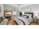 Bright bedroom with a desk, ceiling fan, and a natural wood headboard at 1724 W Saint Conrad St, Tampa, FL 33607