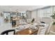 Open-concept dining and kitchen area with modern finishes and ample seating at 1724 W Saint Conrad St, Tampa, FL 33607