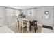 Inviting dining room featuring stylish decor, hardwood floors, and natural light at 1724 W Saint Conrad St, Tampa, FL 33607