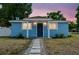 Charming home exterior featuring a covered porch, manicured landscaping, and a welcoming front entrance at 1724 W Saint Conrad St, Tampa, FL 33607
