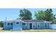 Charming single-story home featuring solar panels, landscaping, and a freshly painted exterior at 1724 W Saint Conrad St, Tampa, FL 33607