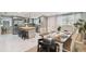 Well-lit kitchen with stainless steel appliances, butcher block island, and eat-in dining area at 1724 W Saint Conrad St, Tampa, FL 33607