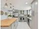 A spacious kitchen featuring stainless steel appliances and an island countertop at 1724 W Saint Conrad St, Tampa, FL 33607