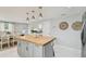 Bright kitchen boasts a butcher block island, stainless steel appliances, and stylish decor at 1724 W Saint Conrad St, Tampa, FL 33607