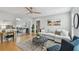 Bright and inviting living room featuring hardwood floors, comfortable seating, and lots of natural light at 1724 W Saint Conrad St, Tampa, FL 33607