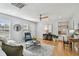 Comfortable living room with natural light, stylish decor, and hardwood floors at 1724 W Saint Conrad St, Tampa, FL 33607