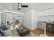 Bright living room with view into a kitchenette and bonus sitting area with great lighting at 1724 W Saint Conrad St, Tampa, FL 33607