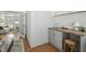 Relaxing living room looking into a kitchenette with access to a bonus sitting area at 1724 W Saint Conrad St, Tampa, FL 33607