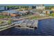 Aerial view of a lively waterfront district with restaurants, shops, and a pier with seating overlooking the water at 1724 W Saint Conrad St, Tampa, FL 33607