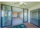 Balcony view through sliding doors, showing bright living room and view of the marina at 1805 Mariner Dr # 52, Tarpon Springs, FL 34689