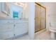 Bathroom with vanity, wall mirror, enclosed shower and toilet at 1805 Mariner Dr # 52, Tarpon Springs, FL 34689