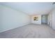 Bright and airy living room with neutral carpet and plenty of space for entertaining at 1805 Mariner Dr # 52, Tarpon Springs, FL 34689