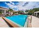 A beautiful swimming pool surrounded by lush greenery and lounge chairs, perfect for relaxation at 1805 Mariner Dr # 52, Tarpon Springs, FL 34689