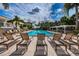 A serene swimming pool area featuring lounge chairs for relaxation and a tranquil atmosphere at 1805 Mariner Dr # 52, Tarpon Springs, FL 34689