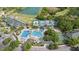 Aerial view of the community with a pool, golf course, tennis court, and lake at 18111 Paradise Point Dr, Tampa, FL 33647