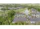 Aerial view of community buildings, parking areas, and water features at 18111 Paradise Point Dr, Tampa, FL 33647