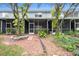 This backyard features screened patios and thoughtful landscaping at 18111 Paradise Point Dr, Tampa, FL 33647