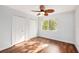 This bright bedroom offers hardwood floors, a ceiling fan, and two closets at 18111 Paradise Point Dr, Tampa, FL 33647