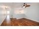 Bright bonus room featuring hardwood floors and a ceiling fan at 18111 Paradise Point Dr, Tampa, FL 33647