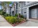 Charming condo with lush landscaping, mature palm trees and a well-maintained exterior at 18111 Paradise Point Dr, Tampa, FL 33647