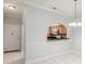 Cozy living room area featuring an archway leading into a kitchen with bar seating at 18111 Paradise Point Dr, Tampa, FL 33647