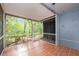 The screened-in patio provides ample space and a tranquil view of the surrounding trees at 18111 Paradise Point Dr, Tampa, FL 33647