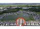Stunning aerial view showcasing the community layout, lake, and the property's prime location within the neighborhood at 20983 Monza Loop, Land O Lakes, FL 34638