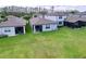 Large backyards featuring a generous lawn area and screened-in patios; perfect for outdoor living at 20983 Monza Loop, Land O Lakes, FL 34638