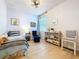 Bedroom with a single bed, neutral decor, and wood-look laminate flooring at 20983 Monza Loop, Land O Lakes, FL 34638