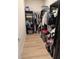 Walk-in closet with custom shelving and ample storage space at 20983 Monza Loop, Land O Lakes, FL 34638